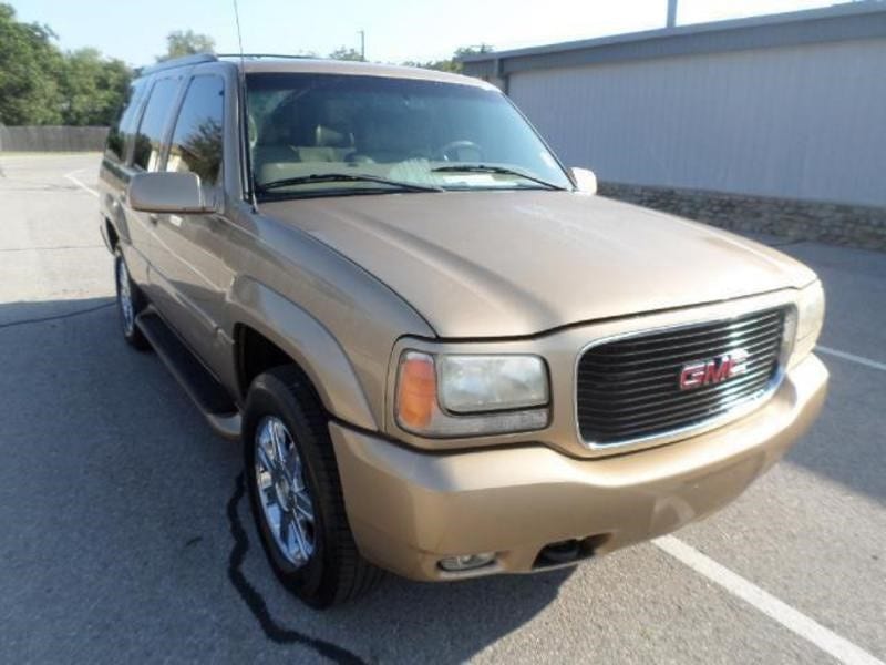 Gold GMC SUV